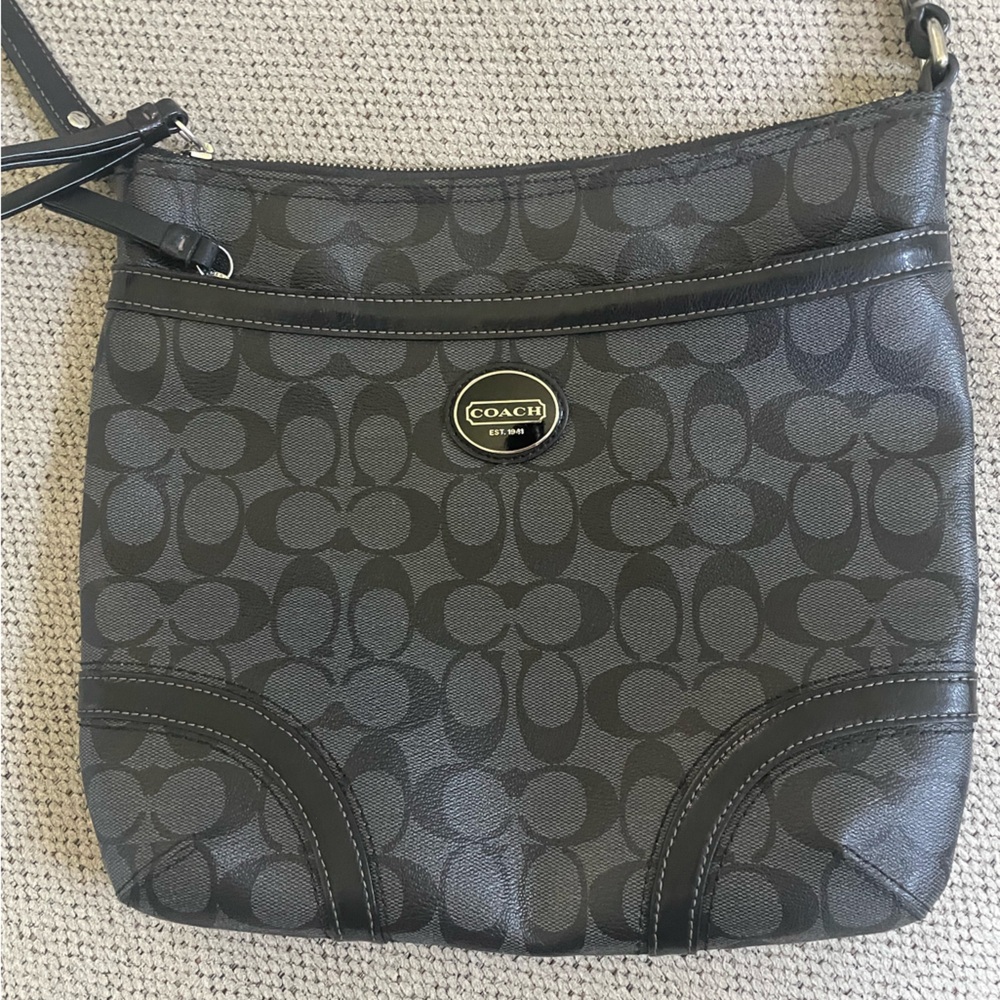 Black cross body. Coach bag.